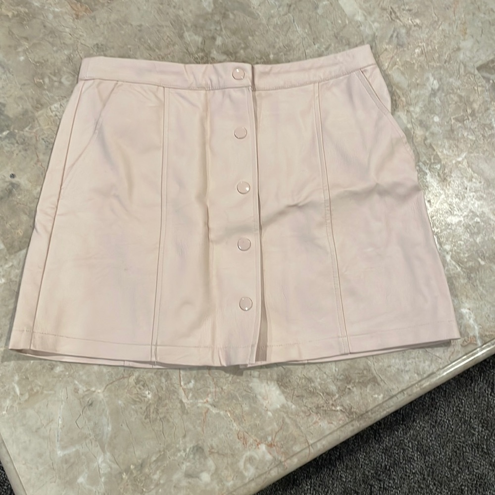 Light pink button mini skirt.